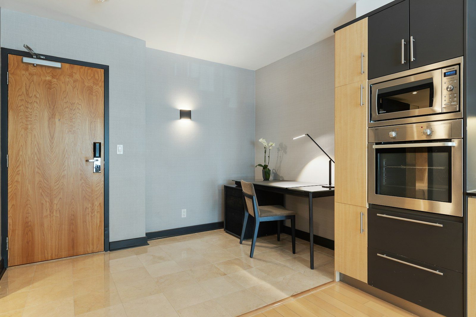 black and white table beside brown wooden door